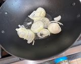 A picture of step 1 of Pork Belly Bistek.