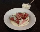 A picture of step 14 of Roast Pork Tenderloin wrapped with Pastrami and served with a Romano / Marscapone Cream Sauce.