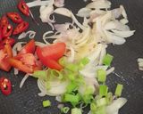 A picture of step 2 of Stir-Fried Enoki Mushrooms and Tofu with Oyster Sauce.