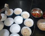 A picture of step 4 of Christmas special vanilla tutti fruti cup cakes.