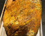 A picture of step 10 of Baked Tilapia Fish served with rocket leaves.