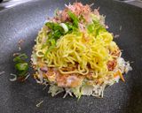 A picture of step 5 of Omu-Okonomiyaki (Japanese as-you-like pancake wrapped with egg).