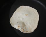 A picture of step 9 of Chatpata naan with aloo tikki wrap.