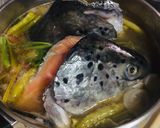A picture of step 7 of Salmon & Kang Kong in Tamarind Broth : Filipino Fish Sinigang > Savoury Sour Soup vs Tom Yum.