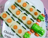 A picture of step 4 of Super Bird train Sandwich with nuggets and tea.