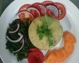 A picture of step 7 of Mashed Matoke, fried sukumawiki, Raw carrots n tomatoes.