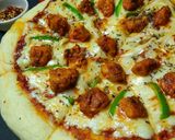 A picture of step 11 of Chicken Tikka Pizza.