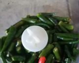 A picture of step 2 of Rajasthani Green chilli kutta.