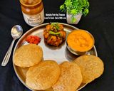 A picture of step 4 of Aamras, Puri, Potato Dry Sabzi (Gujarati Mini Lunch Thali).