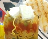 A picture of step 8 of Maggi coins with bowl of veg noodles.