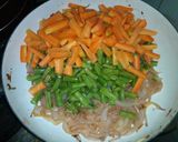 A picture of step 2 of White rice,palm oil stew and veg.sauce.