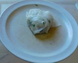 A picture of step 4 of A novel recipe- ravioli/samosa  made with rice paper stuffed with veggies.