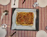 Foto del paso 12 de la receta: Empanada de hojaldre con bacon, cebolla, pimiento rojo, champiñones y nata para cocinar