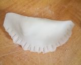 A picture of step 15 of Bihari Dal Pitha.