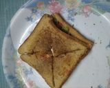 A picture of step 7 of पुफ पैनर पिज्जा सैंडविच.
