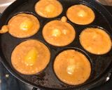 A picture of step 7 of Unniyappam~traditional Kerala snack.