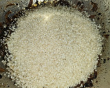 Foto del paso 5 de la receta: Arroz meloso de chipirones con alcachofas confitadas