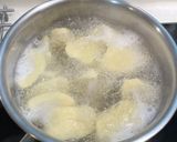 A picture of step 6 of Coconut Milk Pumpkin Soup with Dumplings.