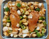 A picture of step 3 of Chicken with Potatoes and Bell Pepper in the Air Fryer.