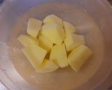 A picture of step 2 of Trombetta Squash with Tomato and Potatoes.