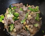 A picture of step 5 of Beef in gravy sauce over rice.