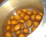 A picture of step 1 of Kashmiri Dum Aloo.