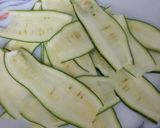 A picture of step 3 of Italian marinated zucchini with broccoli cheese pattice.