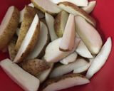 A picture of step 2 of Baked garlic parmesan potato wedges.