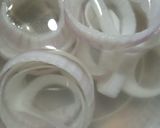 A picture of step 1 of Crispy onion rings.