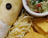 A picture of step 8 of Mexican chicken enchiladas.