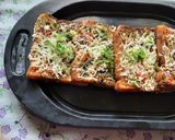 A picture of step 9 of Garlic Brown Bread mix vegetables cheese mini bread pizza.