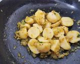 A picture of step 2 of Aloo palakh.