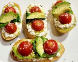 A picture of step 6 of Toasts with Cottage Cheese, Cherry Tomatoes, Guacamole, and More.