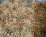 A picture of step 2 of Kunafa and Qashtalia Decorated with Oranges, Strawberries, and Bananas.