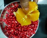 A picture of step 1 of Pomegranate orange juice.