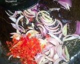 A picture of step 11 of Dambu shinkafa with veg.sauce.