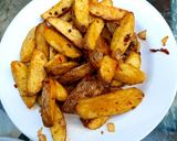A picture of step 4 of My salt pepper & Chilli Wedge Chips 😅.
