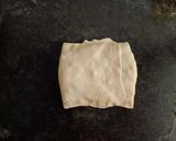 A picture of step 6 of Gozleme / Turkish stuffed flat bread.