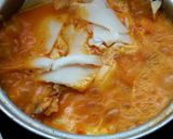 A picture of step 6 of Southern Thai Sour Curry with Salmon Head and Pickled Bamboo Shoots.