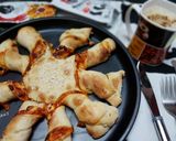 A picture of step 10 of Twisted pizza with tomato and cheese filling.