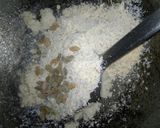 A picture of step 3 of Coconut laddu with dry fruits.