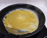 Une image de l'étape 7 de Tamagoyaki (omelette japonaise sucrée).