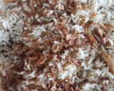 A picture of step 5 of Zeera rice with fried onion.