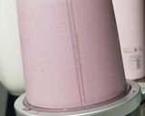 A picture of step 3 of Berry Creamy Popsicles.