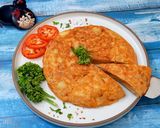 A picture of step 12 of Tortilla Espanola (Spanish Omelette).