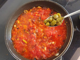 Pasta in spicy chorizo tomato sauce with capers