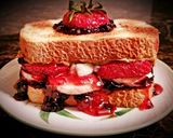 A picture of step 5 of Mike's Ultimate Fruity Nutty PB&J Sandwiches For Kids.