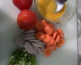 A picture of step 1 of Tomato Egg Soup with Sausage and Carrot Topping.