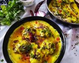 A picture of step 12 of Punjabi kadhi with baked pakoras.