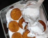 A picture of step 4 of Tiramisu with whipping cream.